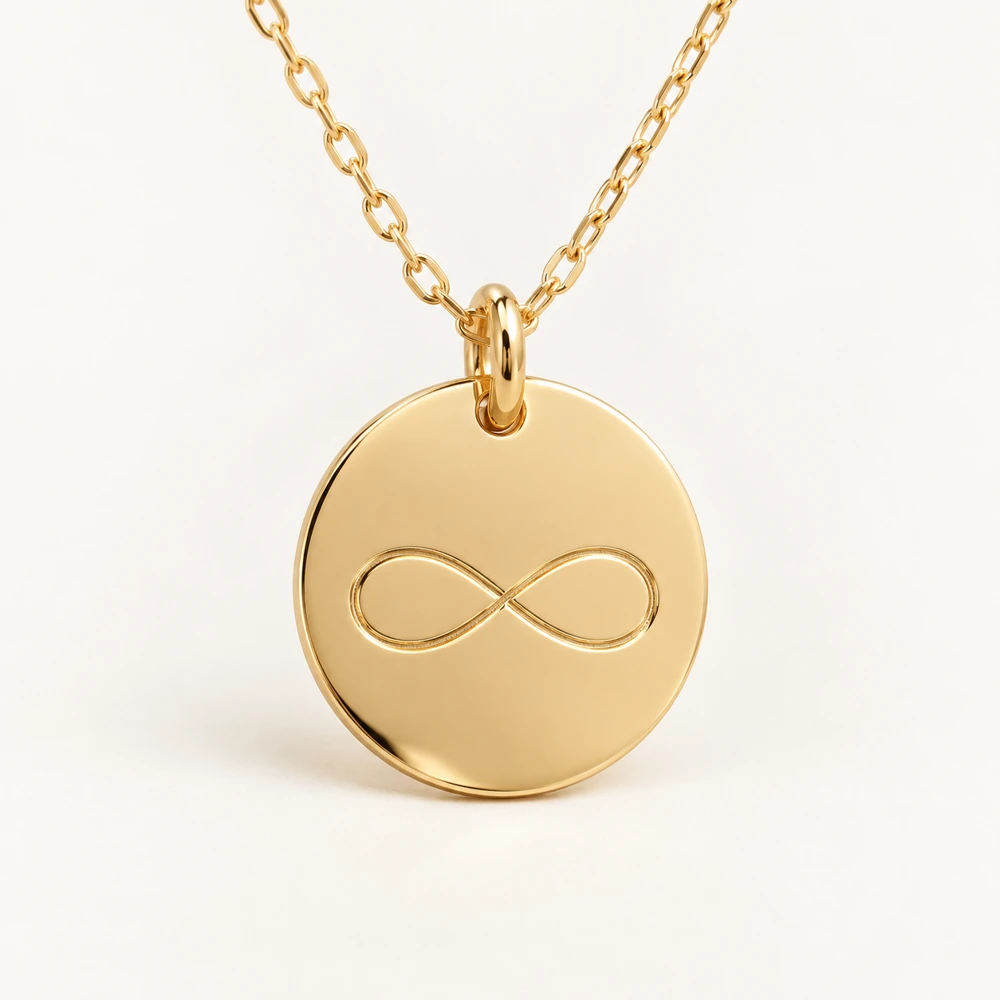 Medalla de símbolo Infinito en oro amarillo. Imagen ilustrativa. Cadena incluida.